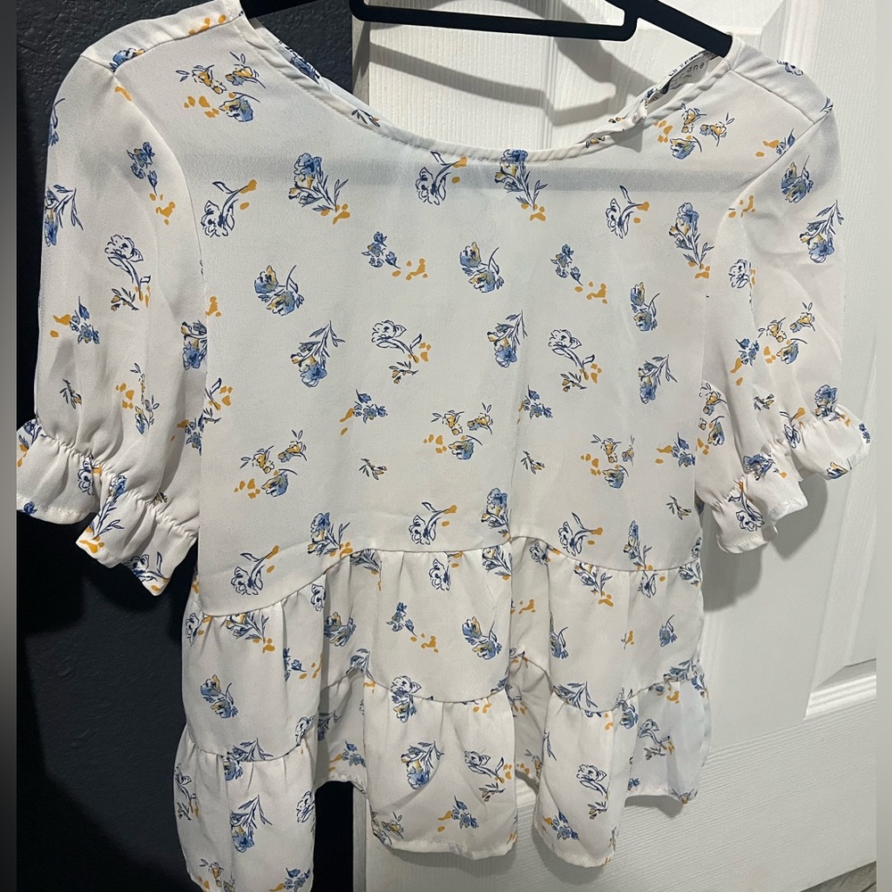 white blouse with flowers